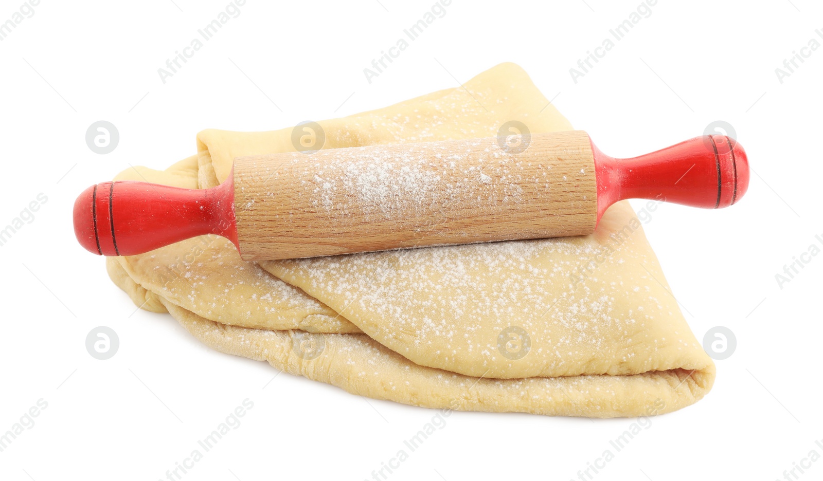 Photo of Raw dough and rolling pin isolated on white