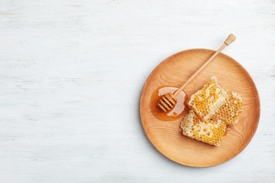 Photo of Flat lay composition with fresh honey on wooden background