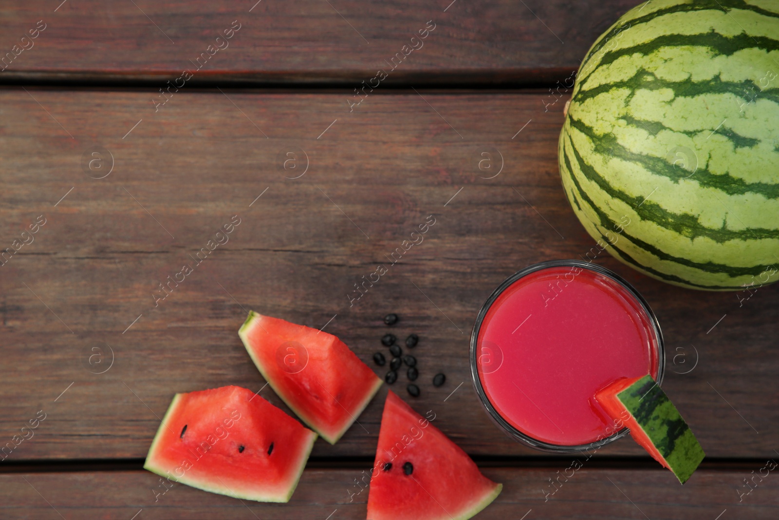 Photo of Delicious watermelon drink and fresh fruit on wooden table, flat lay. Space for text