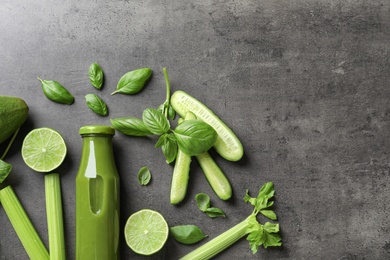 Photo of Flat lay composition with bottle of delicious detox juice and ingredients on grey background