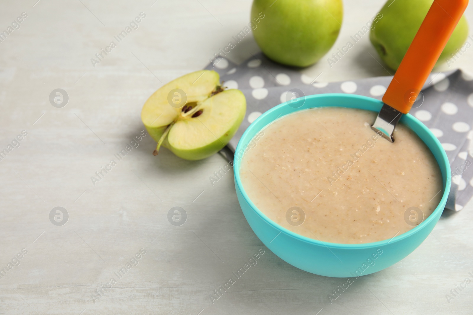 Photo of Bowl of healthy baby food on light table