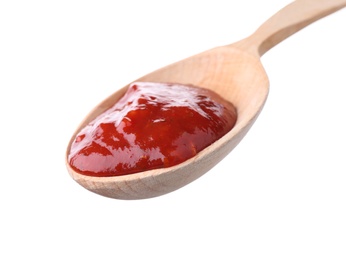 Photo of Wooden spoon with red sauce on white background