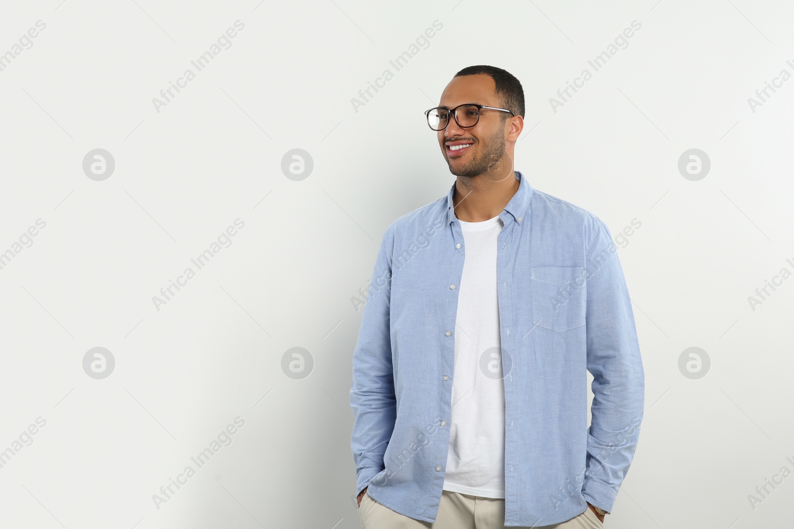 Photo of Portrait of handsome young man on white background, space for text