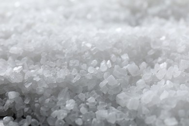 Photo of White natural salt as background, closeup view