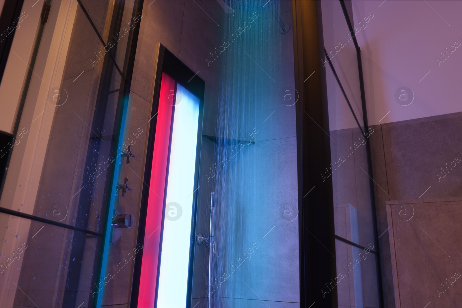 Photo of Modern shower with Infrared spectrum, UV light and flowing water