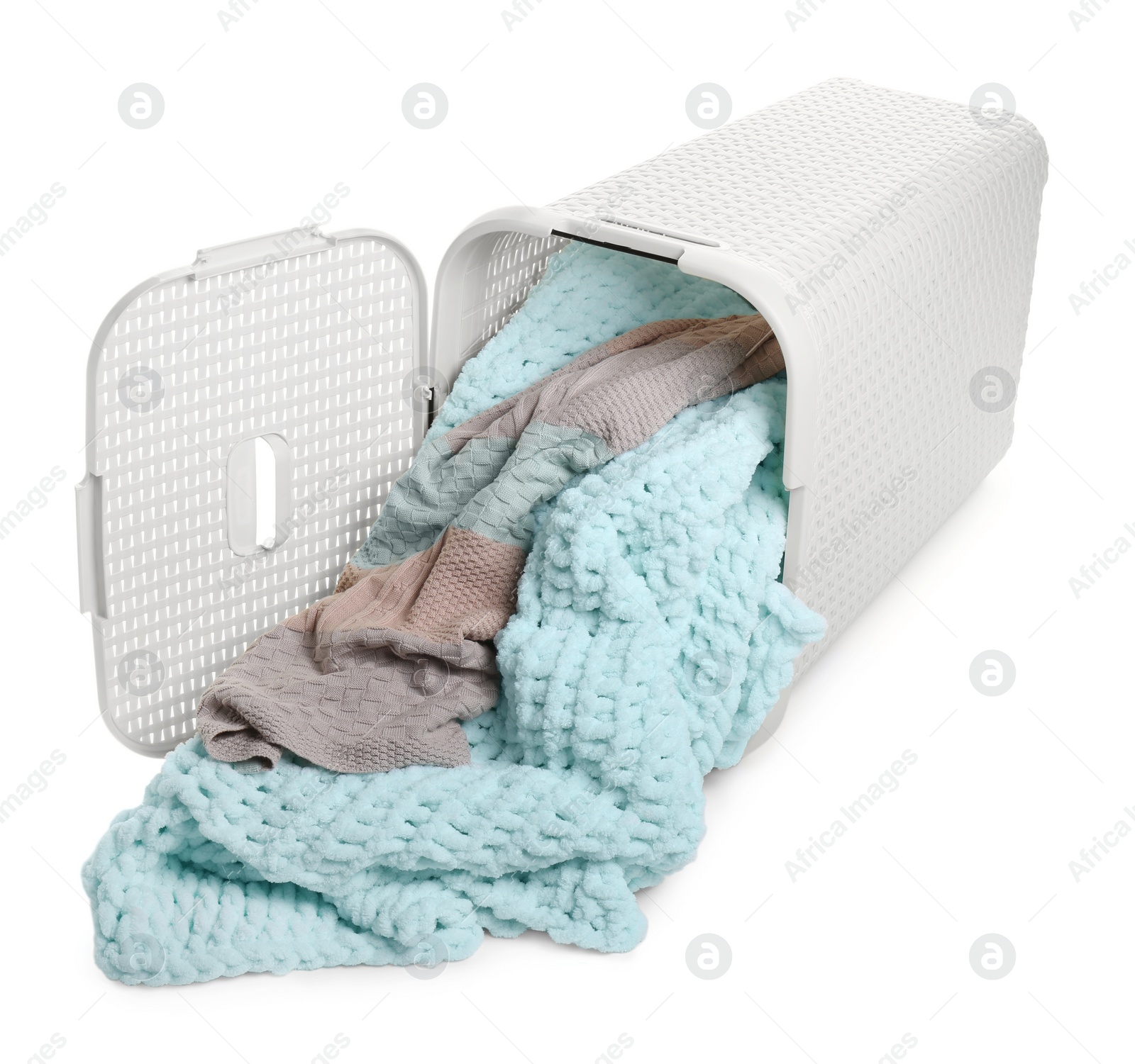 Photo of Open overturned laundry basket with clothes isolated on white