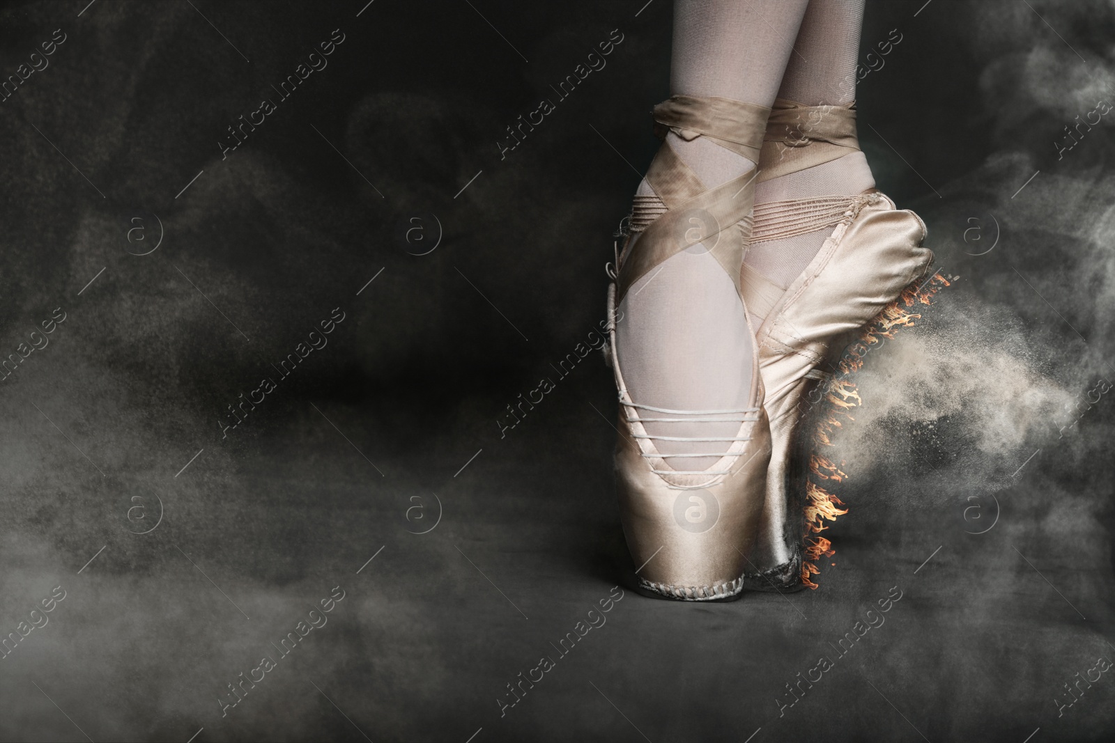 Image of Perfection in ballet. Woman dancing on scene, closeup. Pointe shoe sole burning