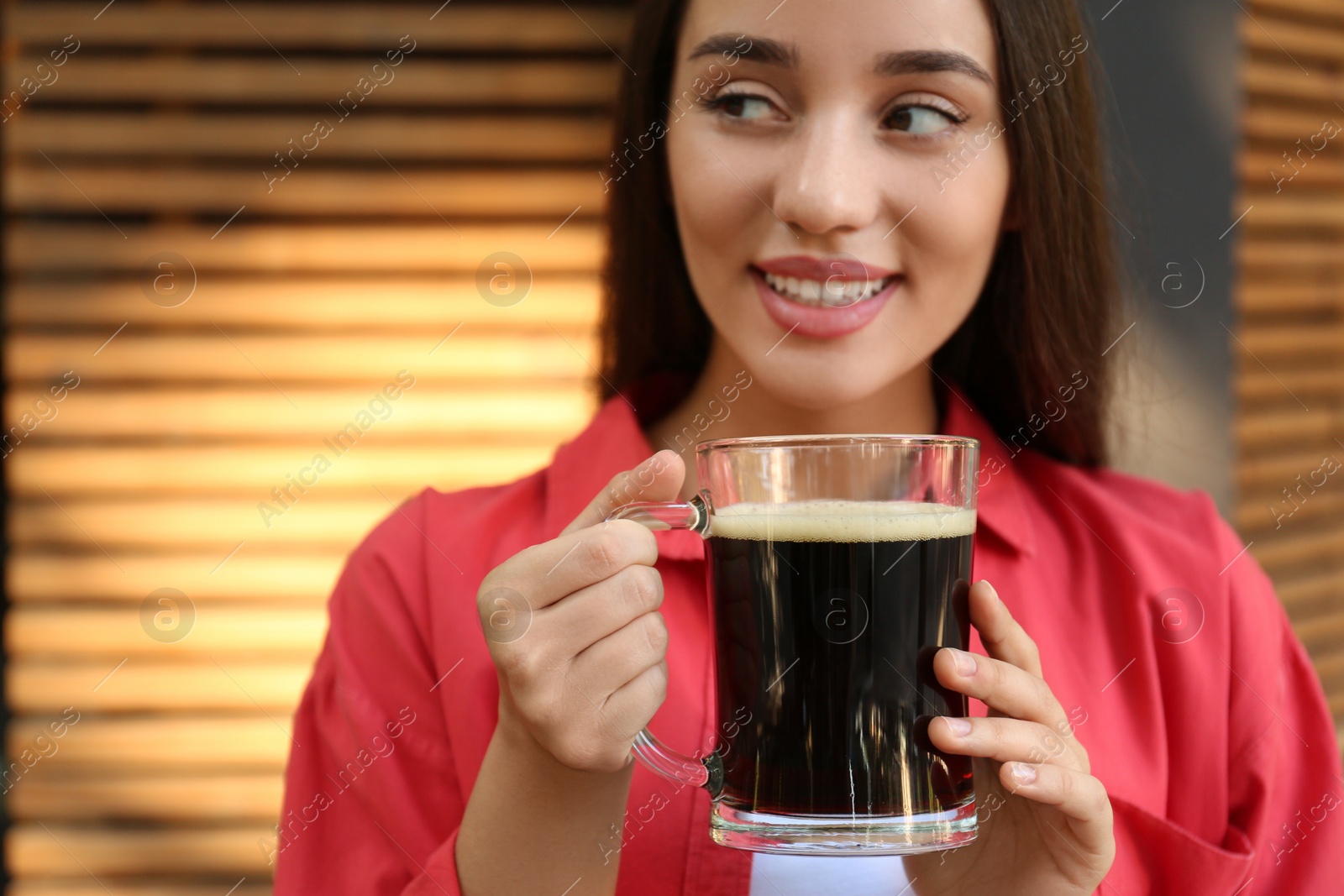 Photo of Beautiful woman with cold kvass outdoors. Traditional Russian summer drink