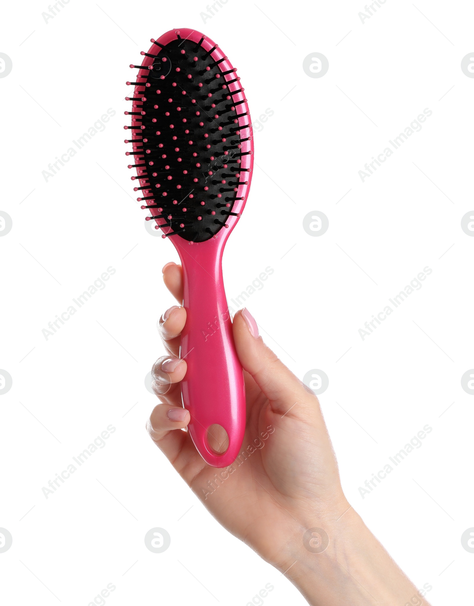 Photo of Woman holding hair brush against white background, closeup