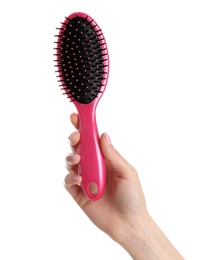 Photo of Woman holding hair brush against white background, closeup