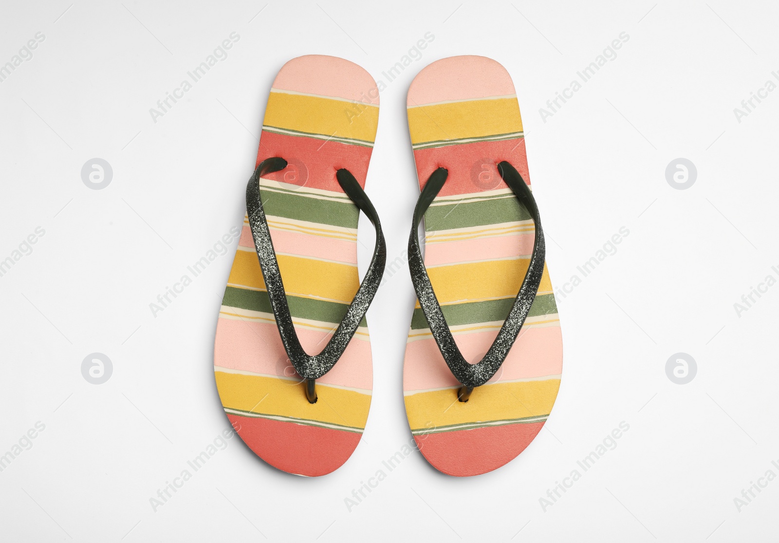 Photo of Pair of flip flops on white background, top view. Beach accessories