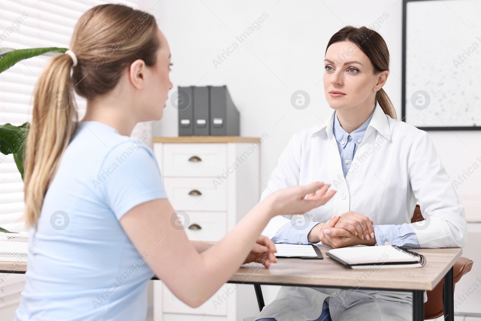 Photo of Mammologist's appointment. Doctor and woman in hospital