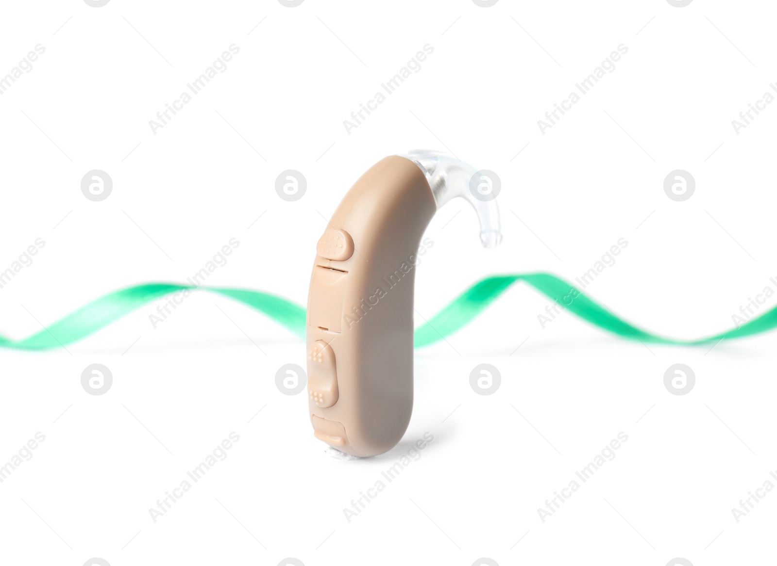 Photo of Hearing aid and ribbon on white background