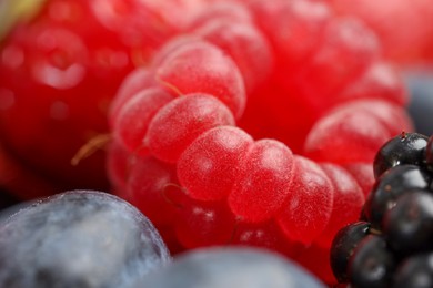 Photo of Different fresh ripe berries as background, macro view