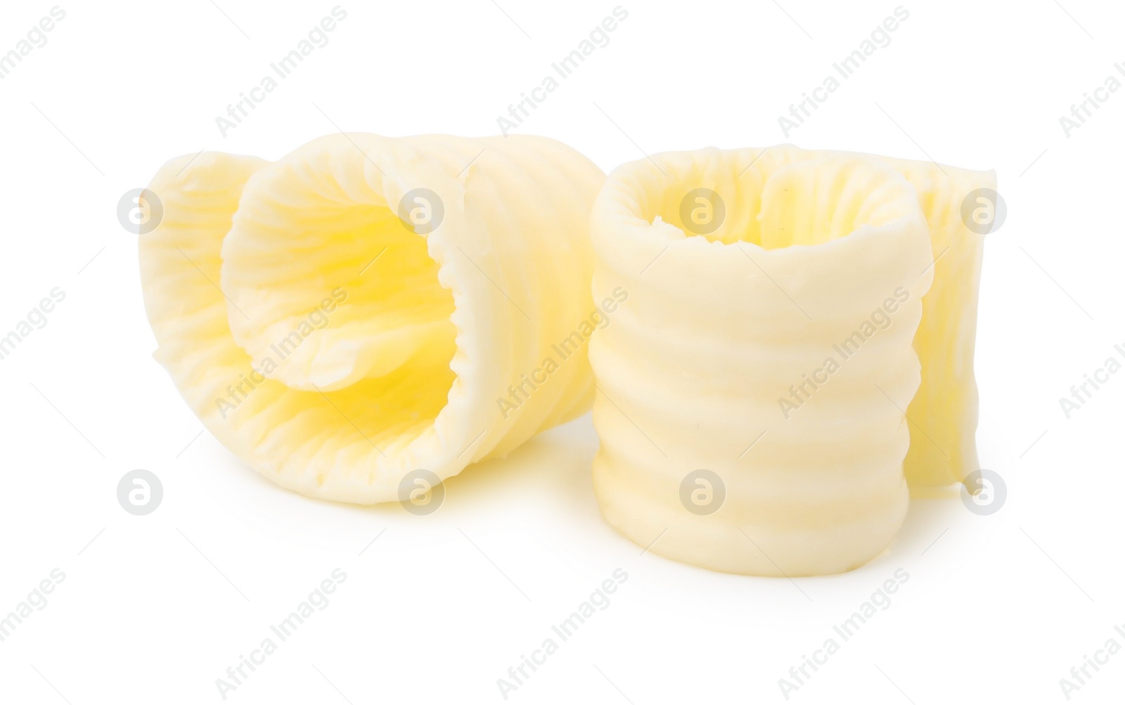 Photo of Fresh tasty butter curls isolated on white