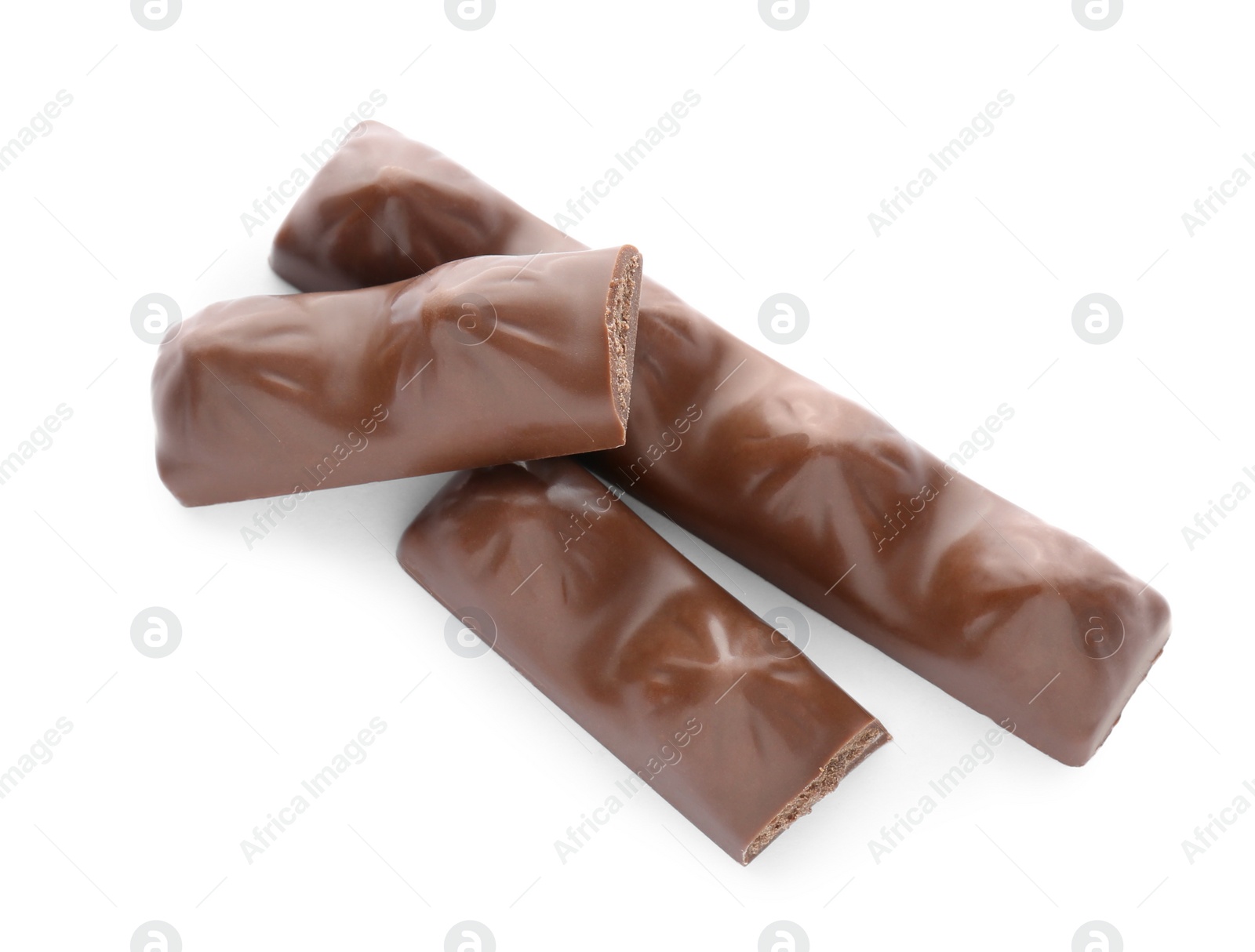 Photo of Pieces of tasty chocolate bars on white background, top view