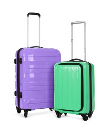 Stylish suitcases packed for travel on white background 