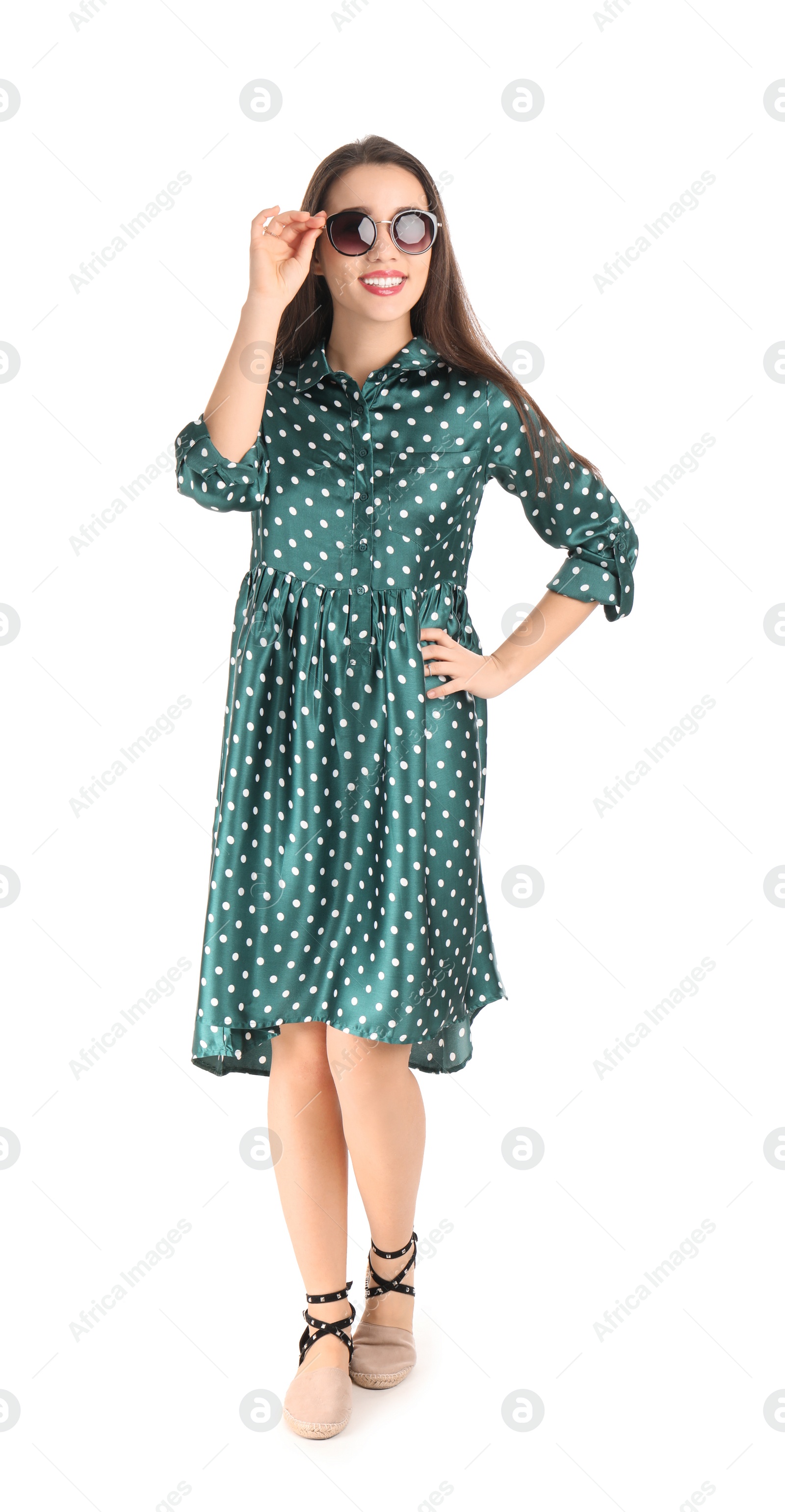 Photo of Portrait of beautiful young woman in stylish dress on white background