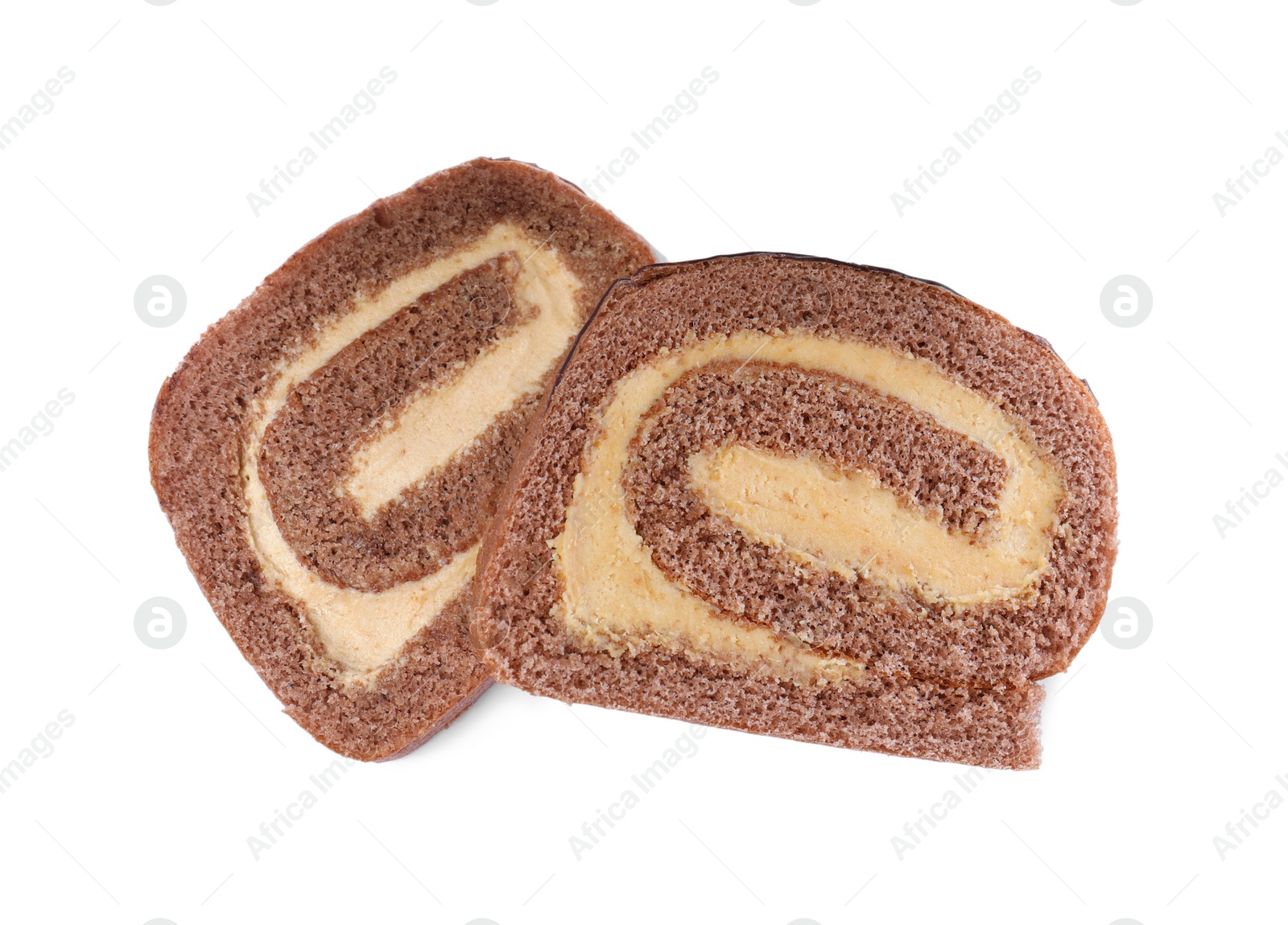 Photo of Slices of tasty chocolate cake roll with cream on white background, top view