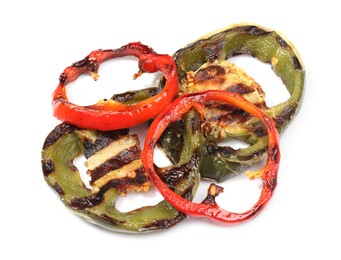 Photo of Slices of grilled peppers isolated on white