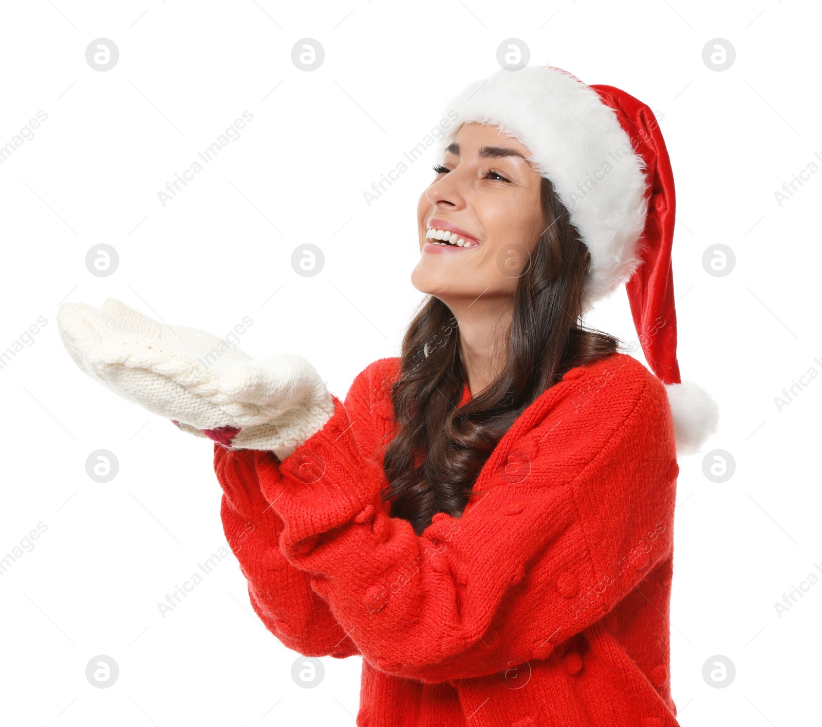 Photo of Young woman in Christmas sweater and hat on white background