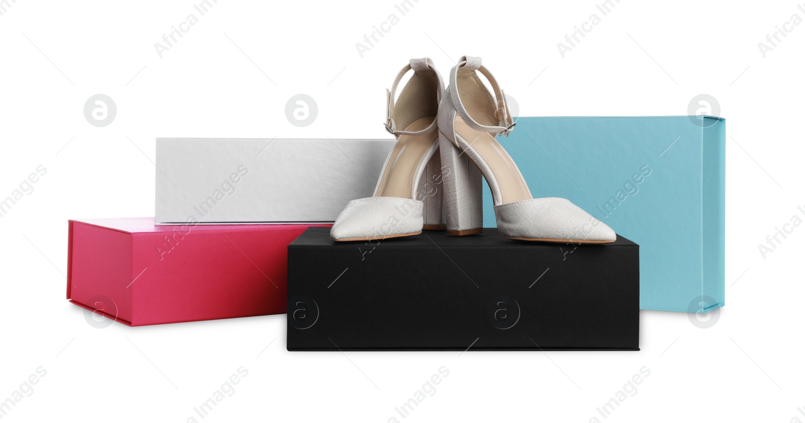 Photo of Pair of stylish shoes and boxes on white background