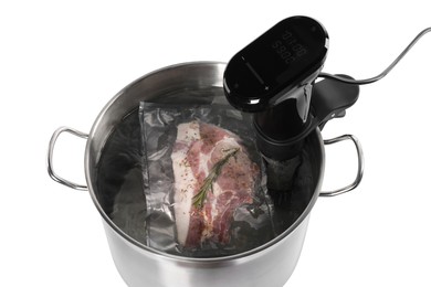 Photo of Thermal immersion circulator and vacuum packed meat in pot on white background. Sous vide cooking