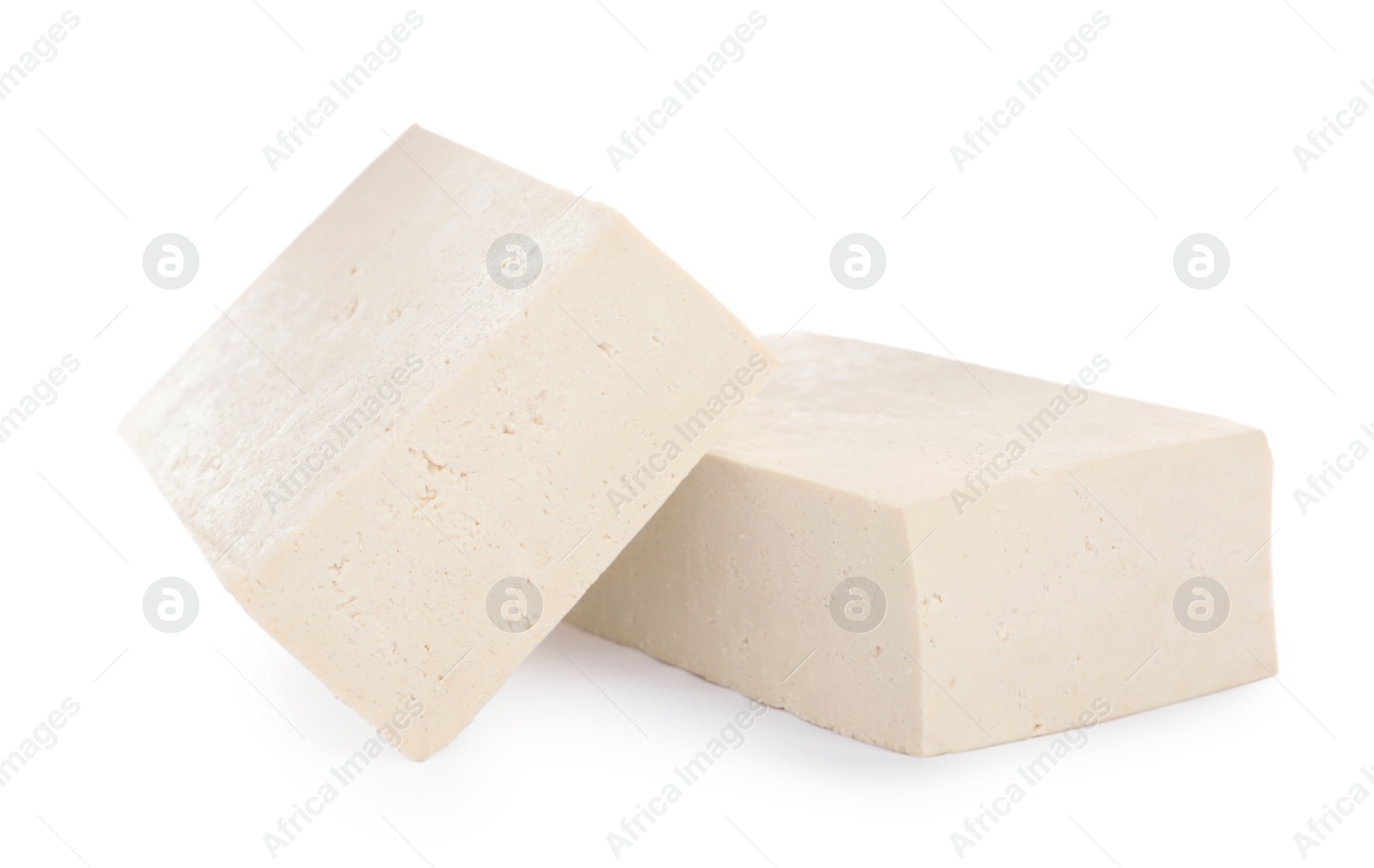 Photo of Blocks of delicious raw tofu on white background