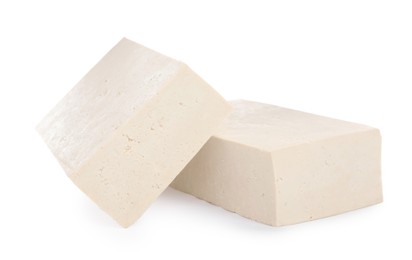 Blocks of delicious raw tofu on white background