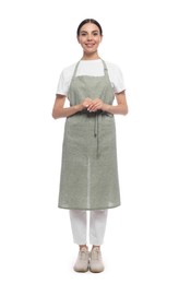 Young woman in light green apron on white background