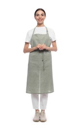 Photo of Young woman in light green apron on white background