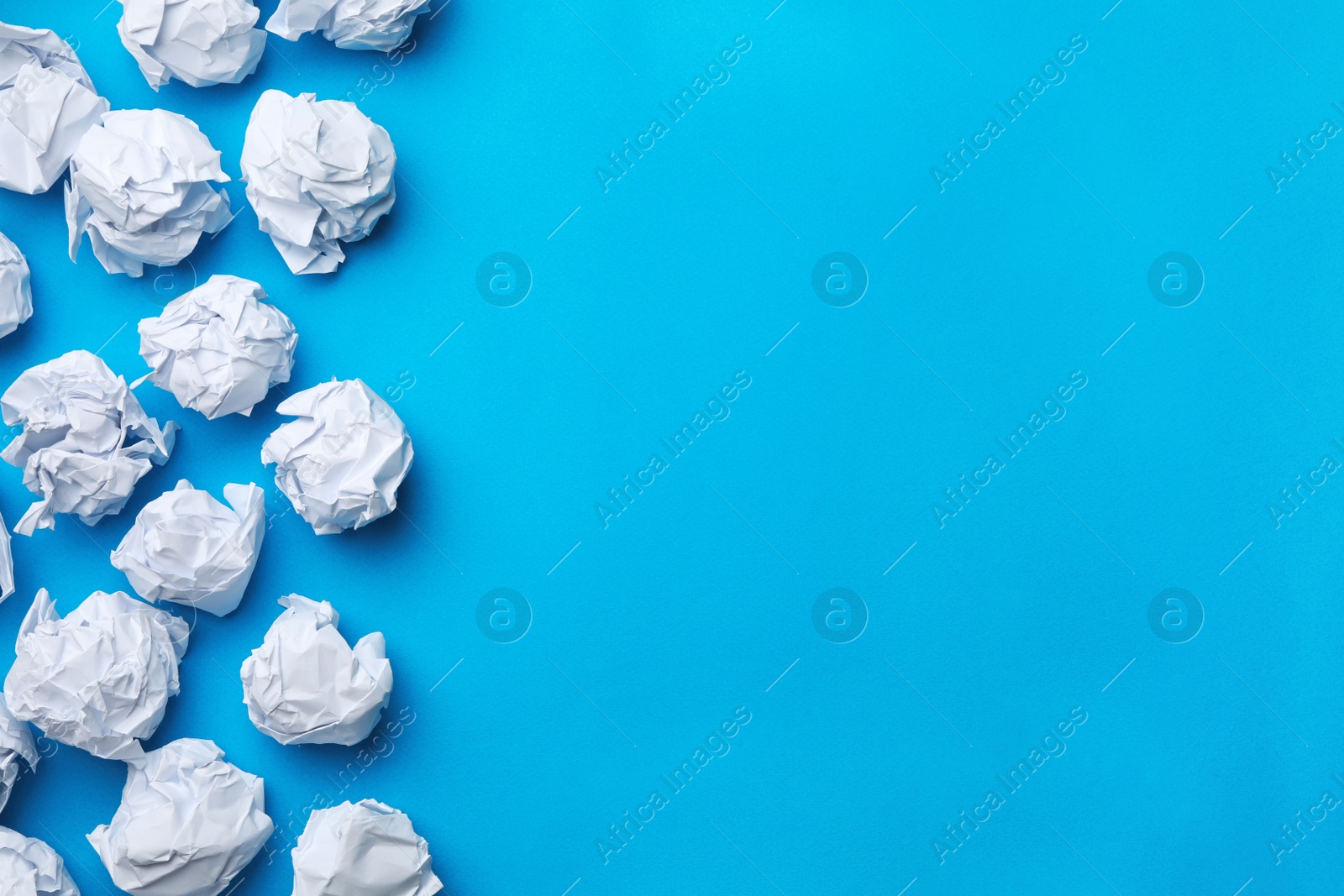 Photo of Paper balls on color background, flat lay. Space for text