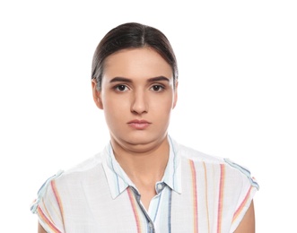 Young woman with double chin on white background