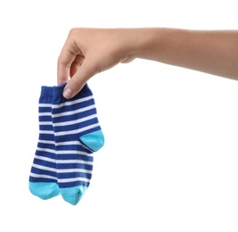 Photo of Woman holding pair of cute child socks on white background, closeup