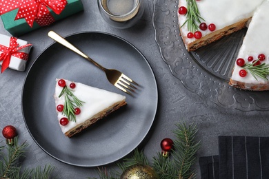Photo of Flat lay composition with traditional Christmas cake on black table