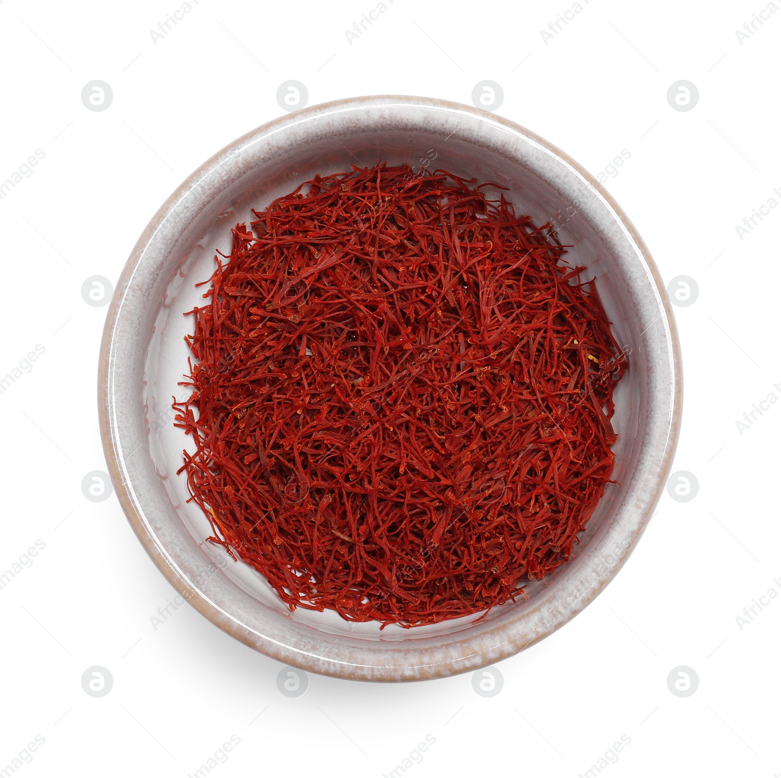 Photo of Aromatic saffron in bowl isolated on white, top view