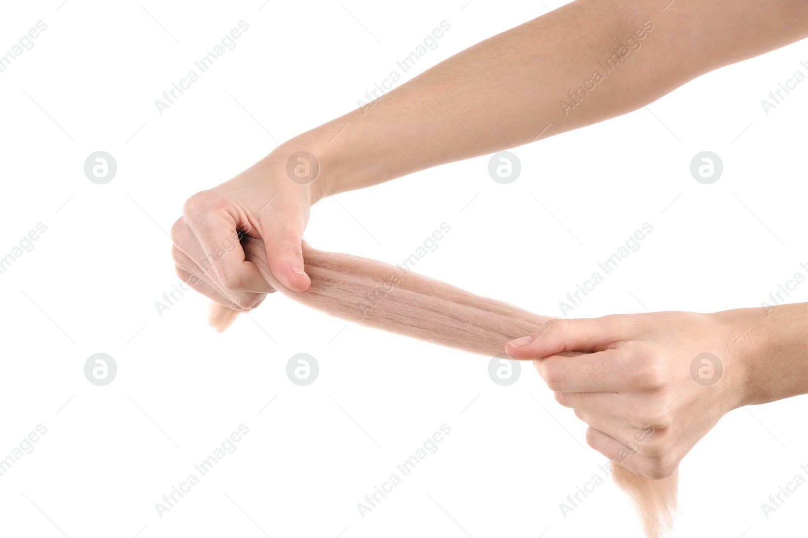 Photo of Woman holding beige felting wool on white background, closeup