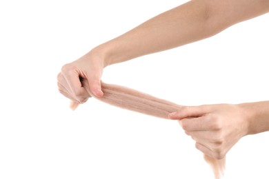 Photo of Woman holding beige felting wool on white background, closeup