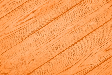 Texture of orange wooden surface as background, top view