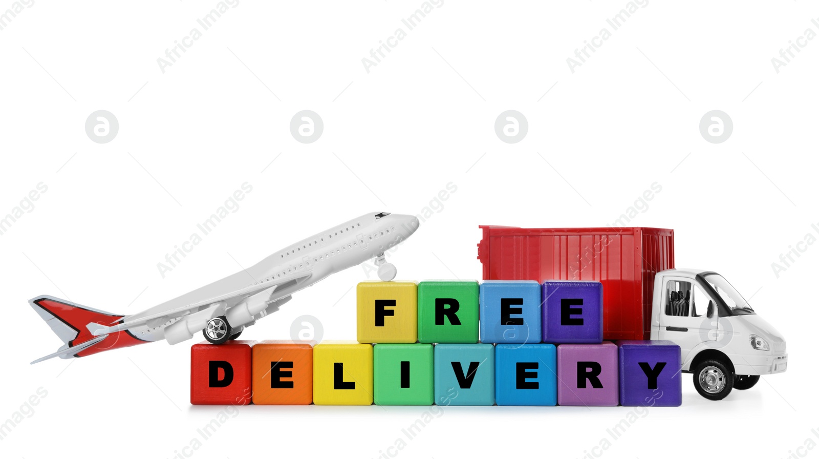Photo of Different logistics transport and cubes with words FREE DELIVERY isolated on white. Logistics and wholesale concept
