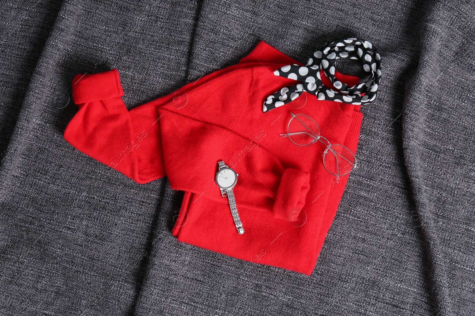 Photo of Cashmere sweater and accessories on soft plaid, top view