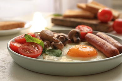 Tasty breakfast with fried egg on table, closeup