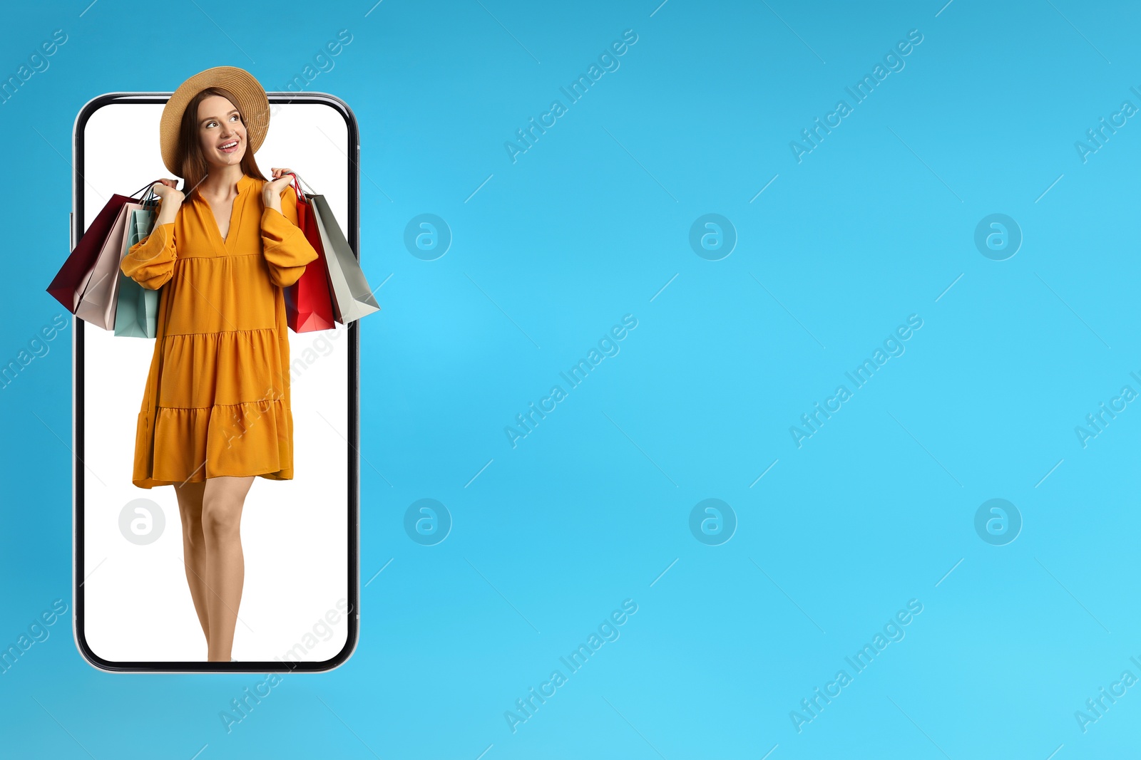Image of Online shopping. Happy woman with paper bags looking out from smartphone on light blue background, space for text