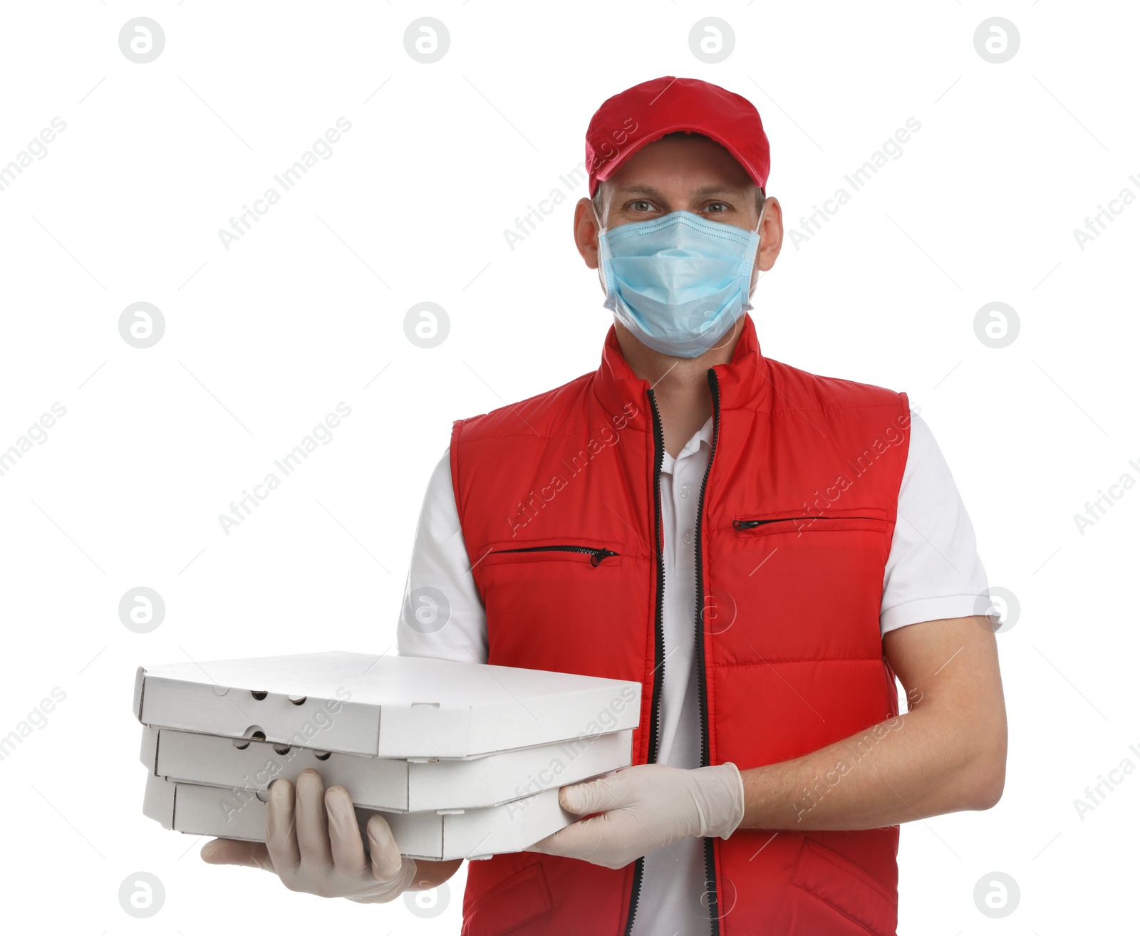 Photo of Courier in protective mask and gloves holding pizza boxes on white background. Food delivery service during coronavirus quarantine