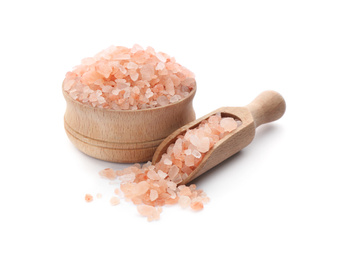 Photo of Bowl and scoop with pink himalayan salt on white background