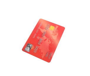 Red plastic credit card isolated on white