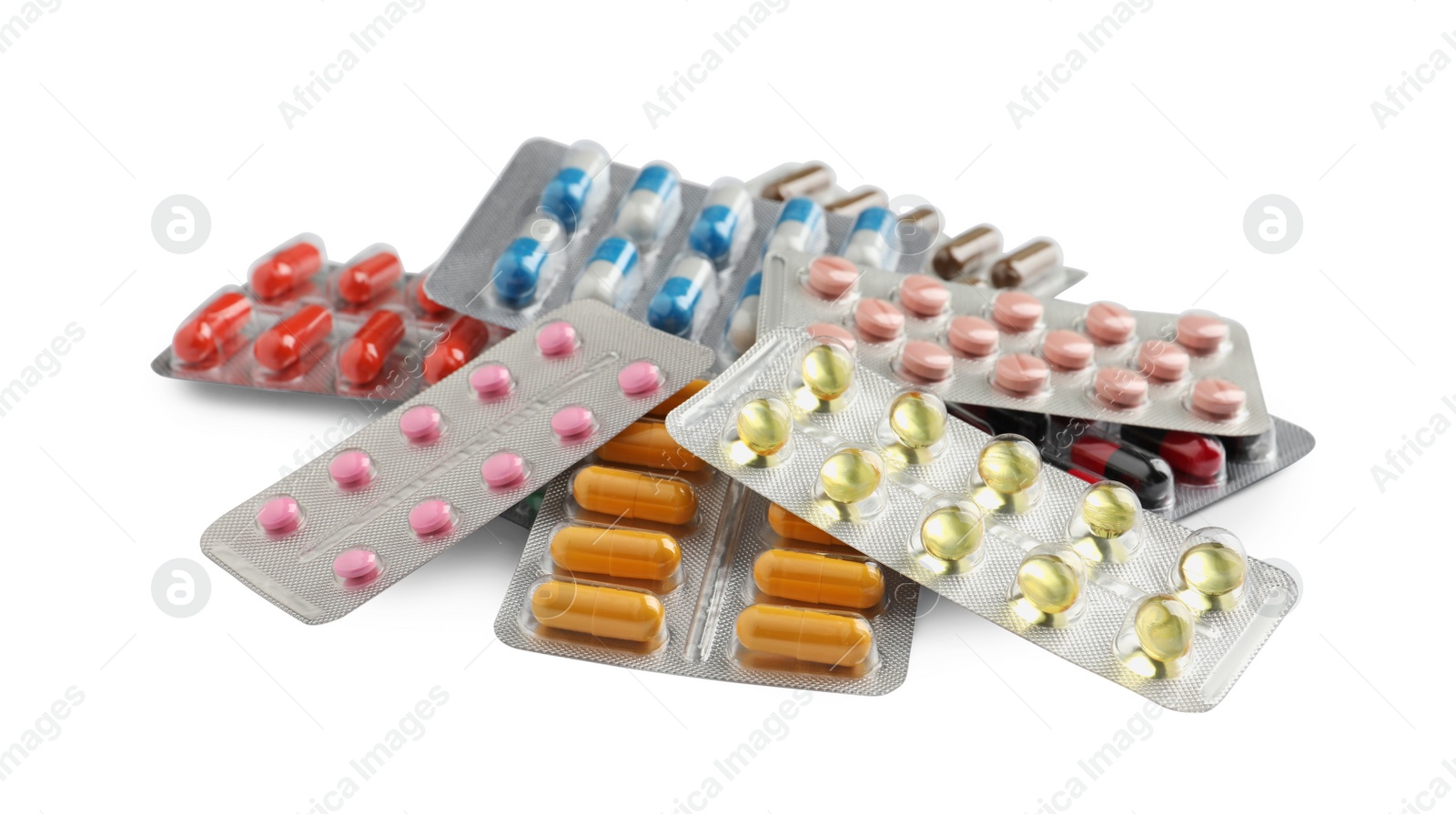 Photo of Pile of different pills in blister packs on white background