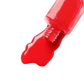 Spilled color nail polish with bottle on white background, top view