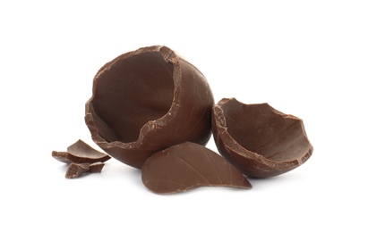 Photo of Broken milk chocolate egg on white background