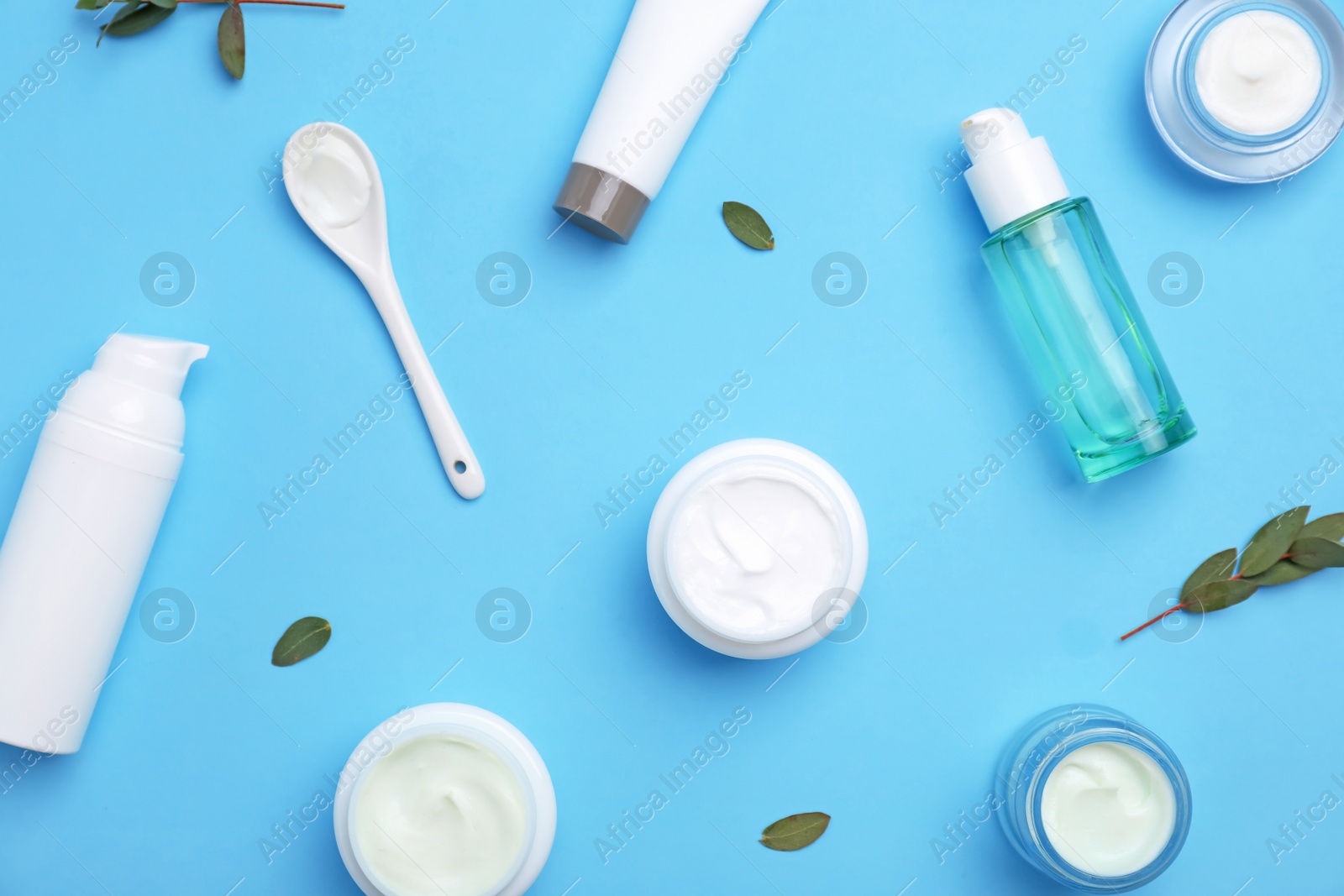 Photo of Flat lay composition with cosmetic products on color background